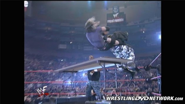 WWE - The Dudley Boyz Put The Hardy Boyz Through Two Tables!